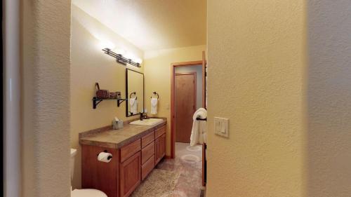 a bathroom with a sink and a mirror at 6 Summit View Lane in Sunriver