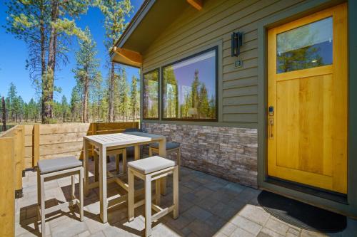 a patio with two tables and chairs on a house at 18112-2 Forestbrook Loop in Bend