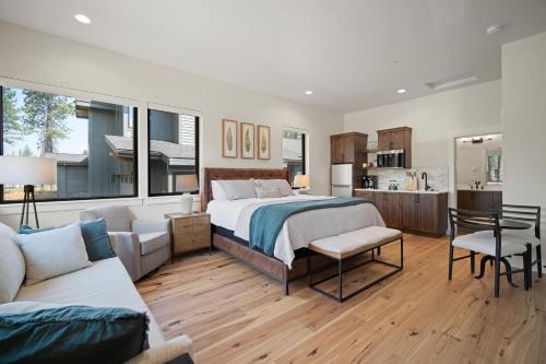 a bedroom with a bed and a living room at 18124-2 Forestbrook Loop in Bend