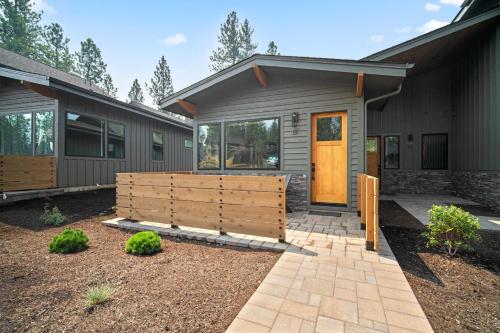 a house with a wooden door in front of it at 18129-2 Forestbrook Loop in Bend