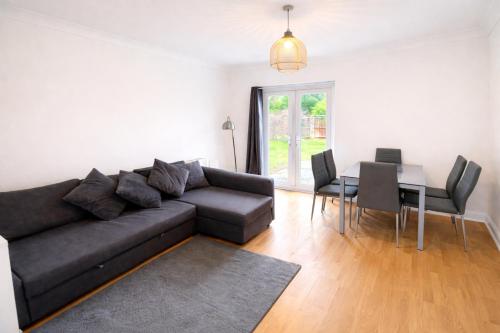 a living room with a couch and a table at Urban in Southampton