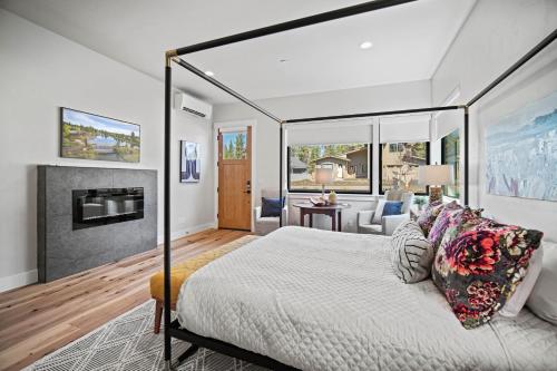 a bedroom with a canopy bed and a living room at 18145-2 Forestbrook Loop in Bend