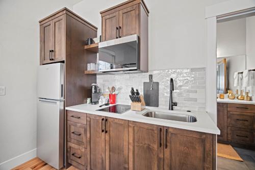 a kitchen with a sink and a refrigerator at 18145-2 Forestbrook Loop in Bend
