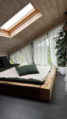 a bed in a room with a mosquito net at Apart Garden з чаном-джакузі in Slavske