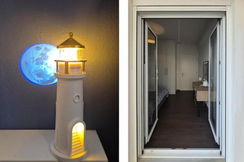 two pictures of a light and a hallway with a lighthouse at Blue Bay Suites in Myloi