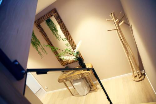 a room with two plants and a glass table at Prime apartment in Liège