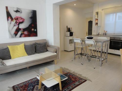 a living room with a couch and a table at Cuatro Camino Apartment with elevator in Madrid