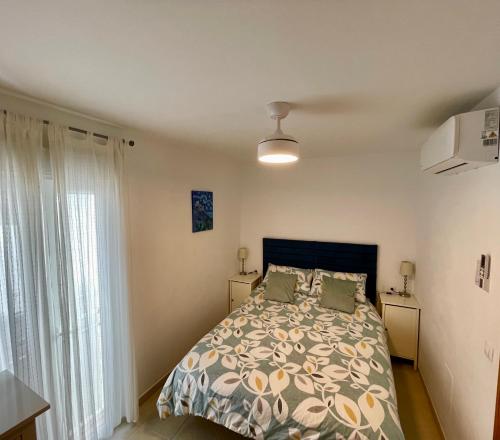 a bedroom with a bed and two pillows at The Town House - Mojacar in Mojácar
