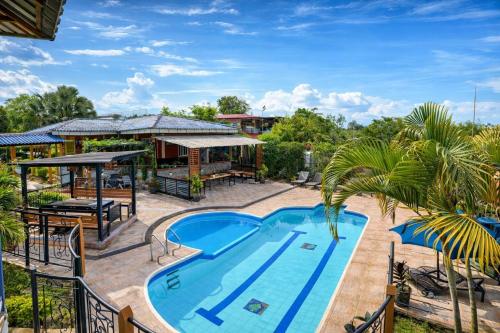 an image of a swimming pool at a resort at Finca Campestre Villa del Campo in Santa Rosa de Cabal