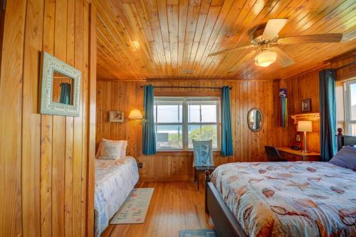 a bedroom with a bed and a ceiling fan at Wave To Cool in Surf City