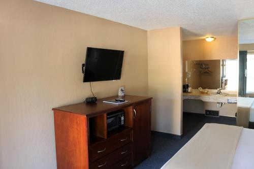 a hotel room with a television on top of a cabinet at Bluelake Inn @ Heavenly Village in South Lake Tahoe