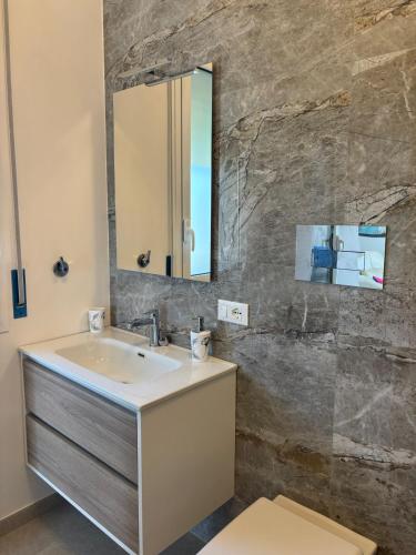 a bathroom with a sink and a mirror at Villa Lina in Agrigento