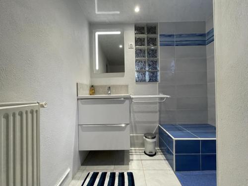 a small bathroom with a sink and a mirror at Etchechoury in Moncayolle-Larrory-Mendibieu
