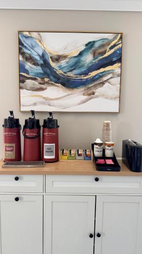 a counter top with two fire hydrants and a painting at Rodeway Inn San Diego South San Ysidro Border in San Ysidro