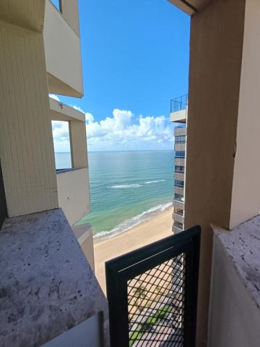 a view of the beach from the balcony of a condo at Flat Costa Mar in Recife
