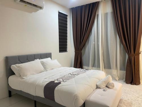 a bedroom with a large bed and a window at The Bunker StudioStay in Arau