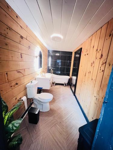 a bathroom with two toilets and a sink at Beautiful cabin surrounded by nature in Catskill