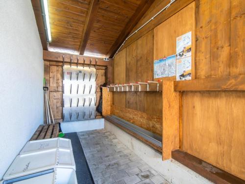 an empty room with a bench in a building at Haus Bergblick in Westendorf