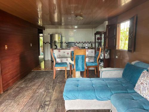 a living room with a couch and a table at Posada el arrecife in Nuquí