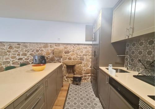 a kitchen with a sink and a counter top at Quinta das Aromáticas in Malta