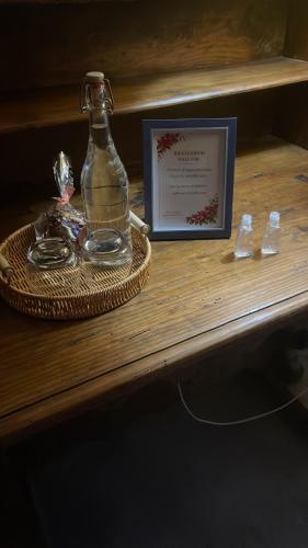 a bottle of water and a sign on a table at Hacienda Bugambilias Boutique Colonial in Cedro