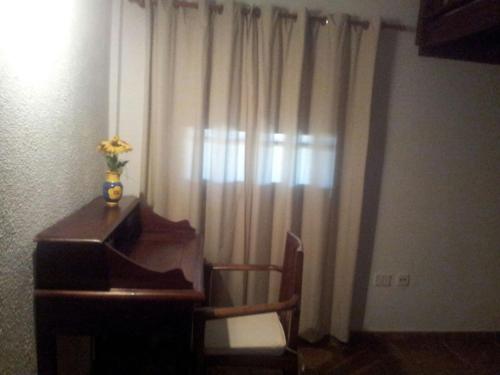 a room with a desk and a window with curtains at Casa Rural El Pajar in El Pinar del Hierro