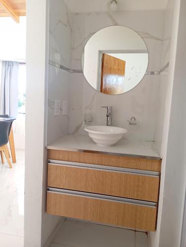 a bathroom with a sink and a mirror at YulFran in Mina Clavero