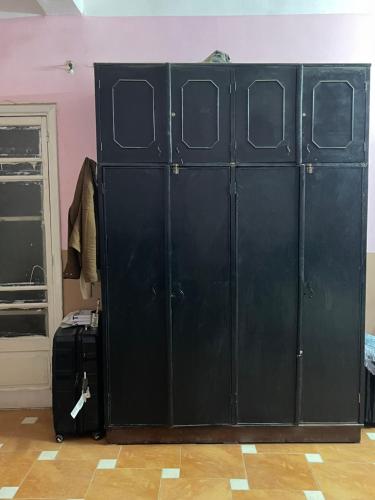a group of green lockers in a room at Beit Gedi in Cairo