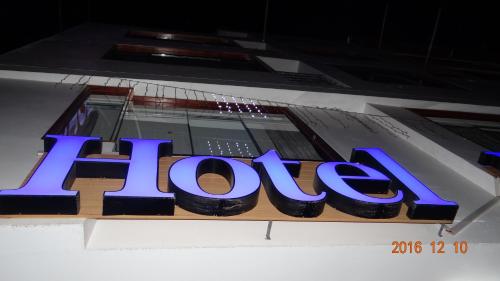 a large blue sign on the side of a store at Hostal Mica in Abancay