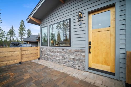 a house with a wooden door and a fence at 18136-2 Forestbrook Loop in Bend