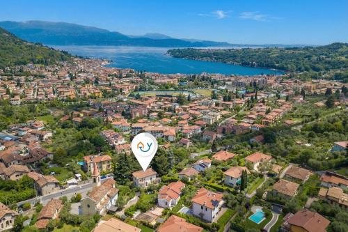 an aerial view of a city with a hot air balloon at Villa Alberti 900m from Garda lake with Garden in Salò