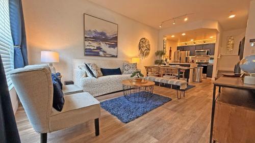 a living room with a couch and a table at Villas at Seven Dwarfs Resort - Near to Disney in Kissimmee