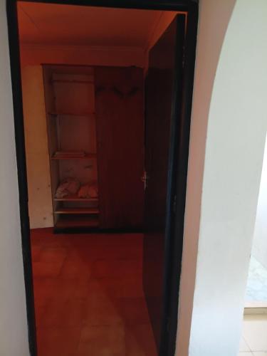 an open door into a room with a closet at Honeymoon villa Diani in Diani Beach