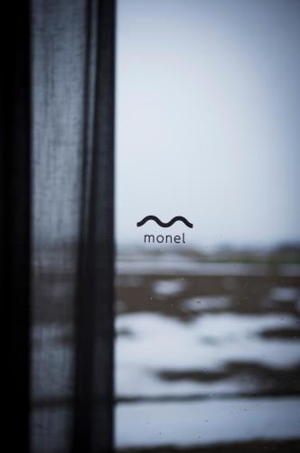 a blurry picture of a window with a sign on it at monel in Nakafurano