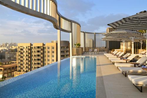 a swimming pool on the roof of a building at Mercure Dubai Deira in Dubai