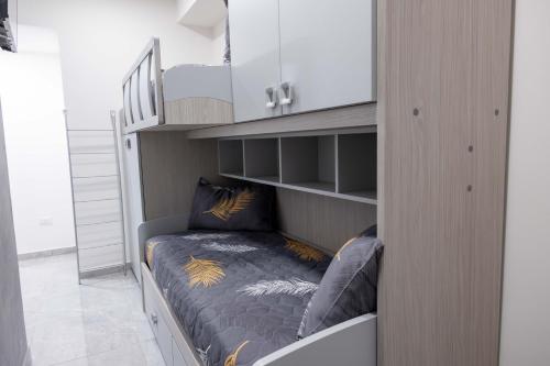 a bedroom with a bunk bed in a room at Ali apartments in Pizzo