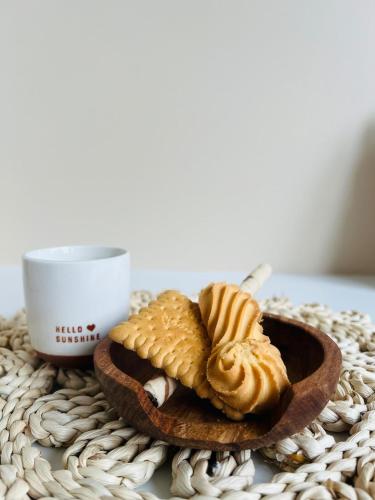 a plate of biscuits and a cup of coffee at Le Stud in Vandoeuvre-lès-Nancy