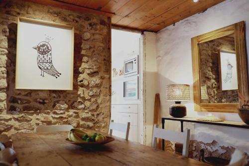 a dining room with a table and a picture of a bird at Mr Banks in Robe