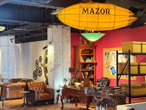 a living room with a surfboard on the wall at Mazor Hotel Hualien Linsen in Hualien City