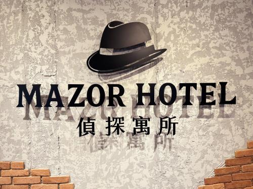 a man in a top hat on a wall at Mazor Hotel Hualien Linsen in Hualien City