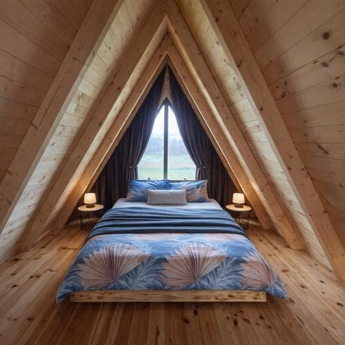 a bed in a room with a large window at Korijeni in Šavnik