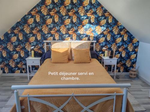 a bedroom with a bed with a mural on the wall at Séjour près de Bayeux avec Massages et repas en options in Tilly-sur-Seulles