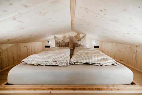 a bedroom with a bed in a attic at Tiny Chalet in Blankenburg