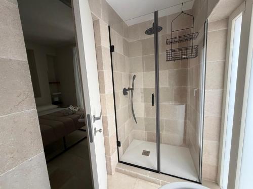 a bathroom with a shower with a glass door at Affittacamere gold 5 in Barletta
