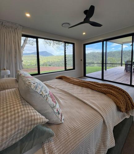 a bedroom with a bed with a large window at Silk & Oak in Darlington