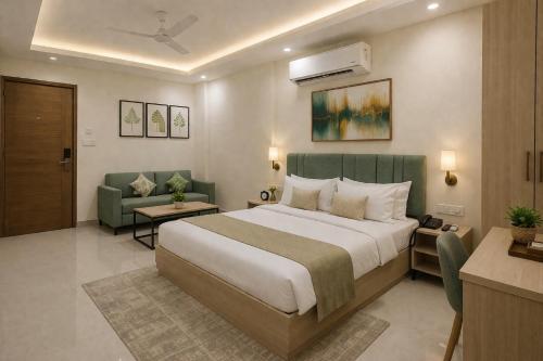 a hotel room with a bed and a couch at OPO Premier Marvel in Jaipur