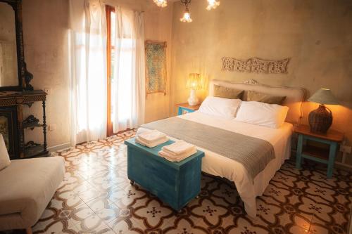 a bedroom with a large bed and a window at Maison de l'Arte di Bà in San Nicola Arcella