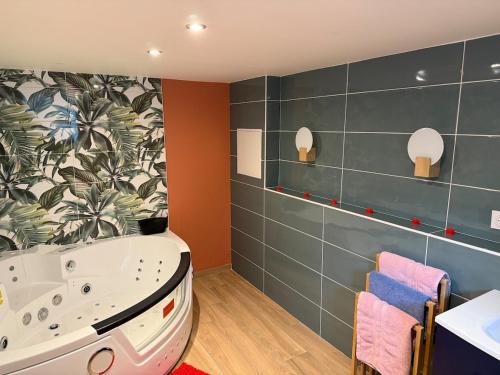 a bathroom with a tub and a sink at Central Grenoble Lovely House in Grenoble