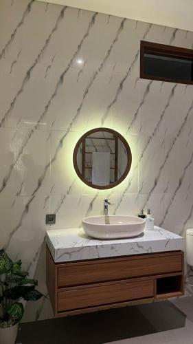 a bathroom with a sink and a mirror at Pondok Wahyu in Ubud