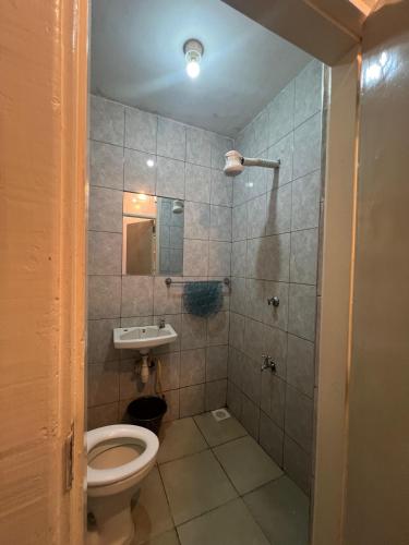a bathroom with a toilet and a sink at Deslly Afrika Stays in Kiambu